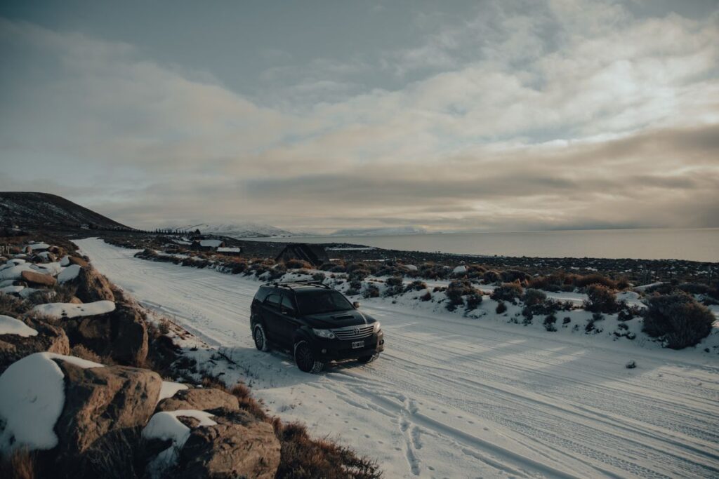 SUV driving on a snowy road