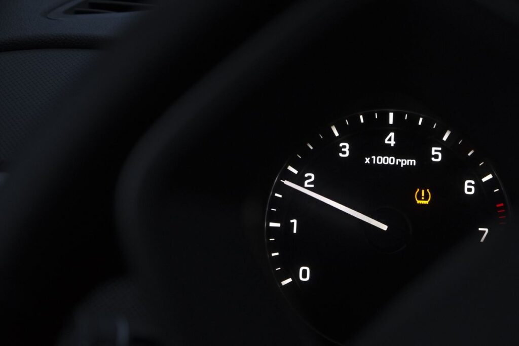 Tachometer with a warning symbol lit