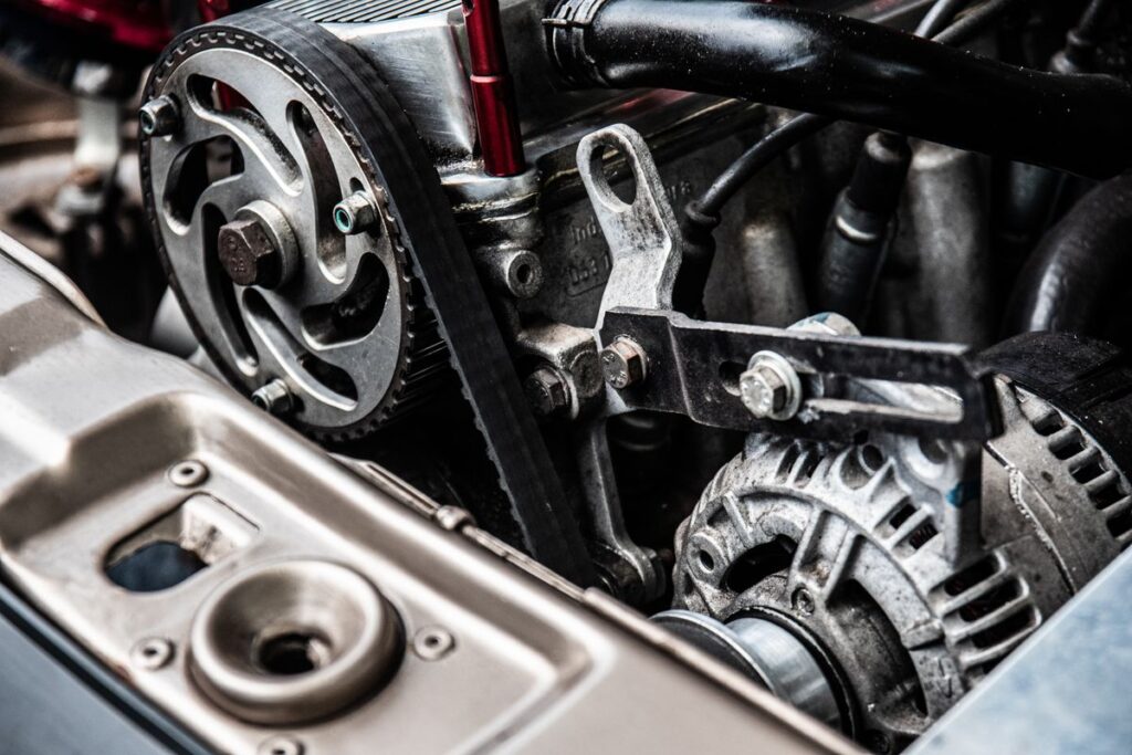 Close-up of an engine with the drive belt and alternator
