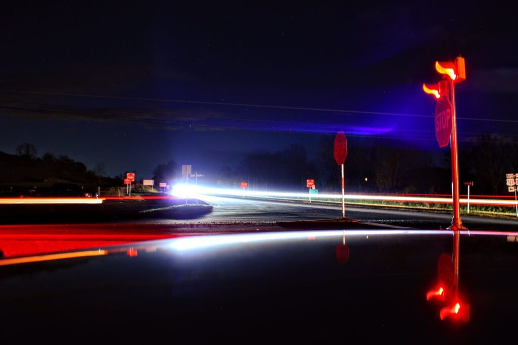 Light trails on a dark road at night