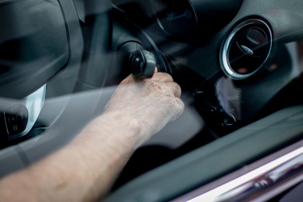 Hand turning the ignition key