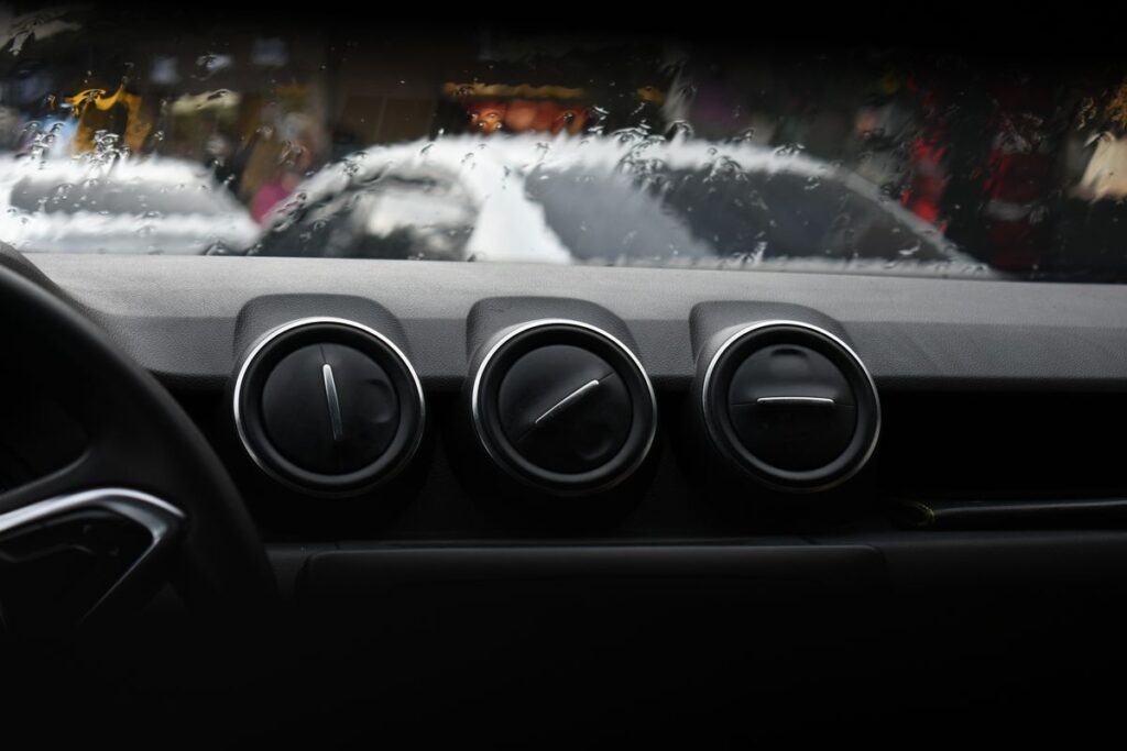 Dashboard vents in front of a frosty windshield