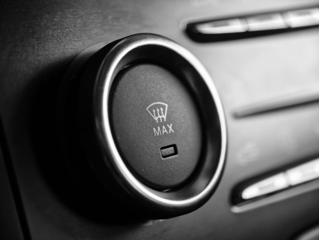 Windshield defrost MAX button on a climate panel