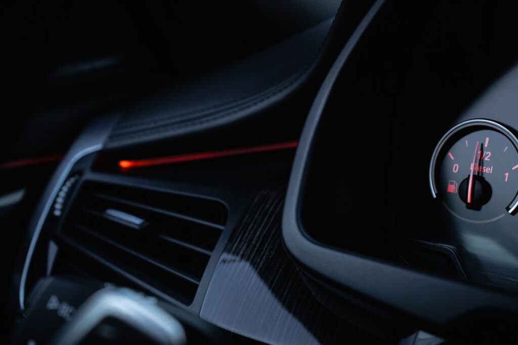 Dashboard air vent beside a gauge