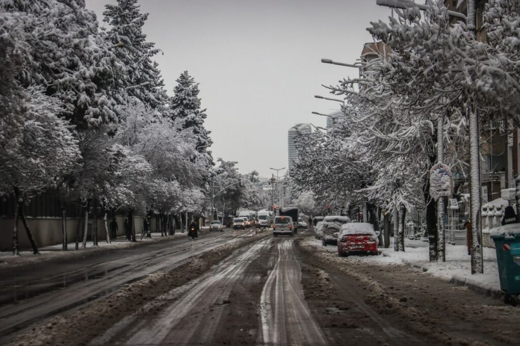 Slushy winter street with traffic
