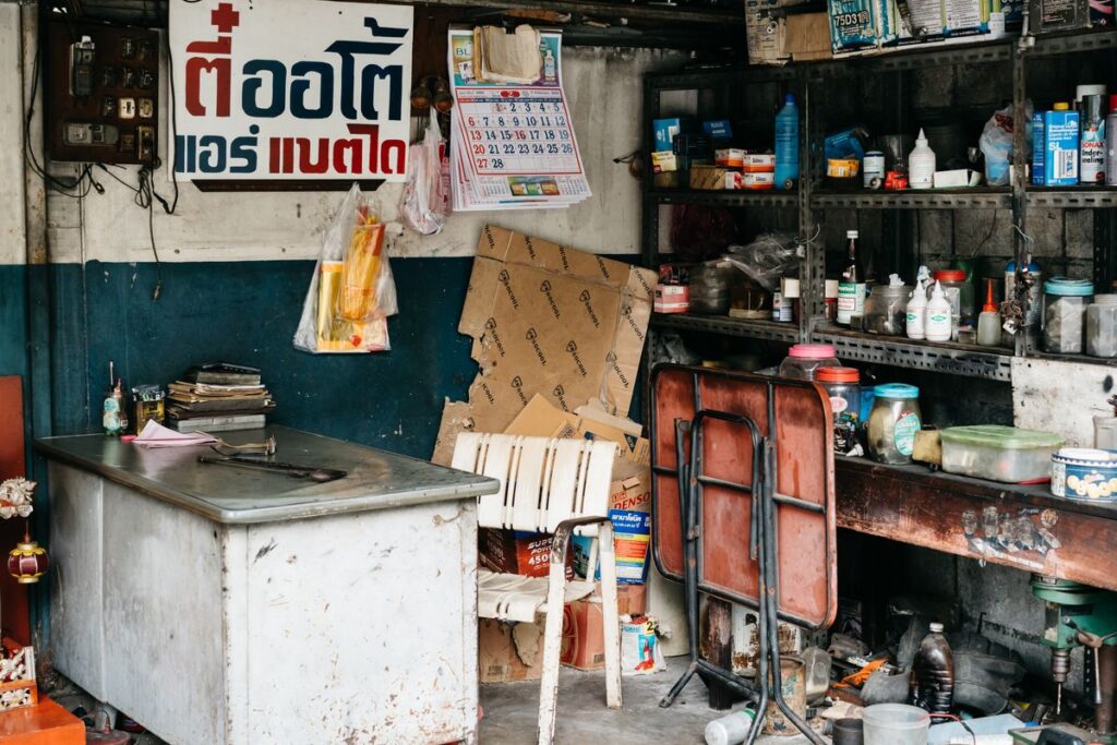 Cluttered workshop with parts on shelves