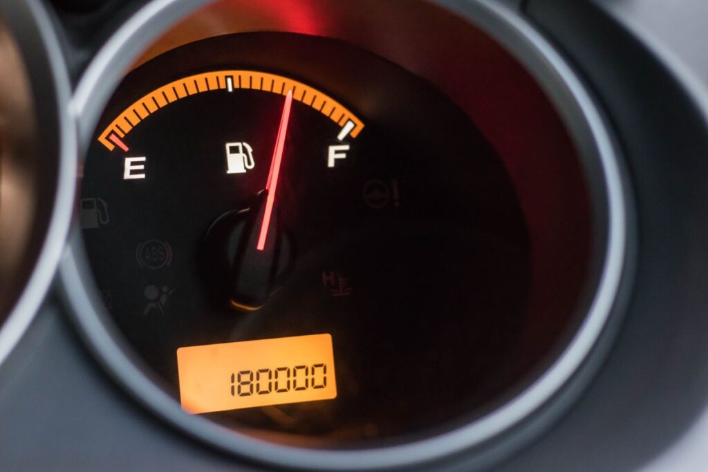 Fuel gauge and an odometer reading 180,000