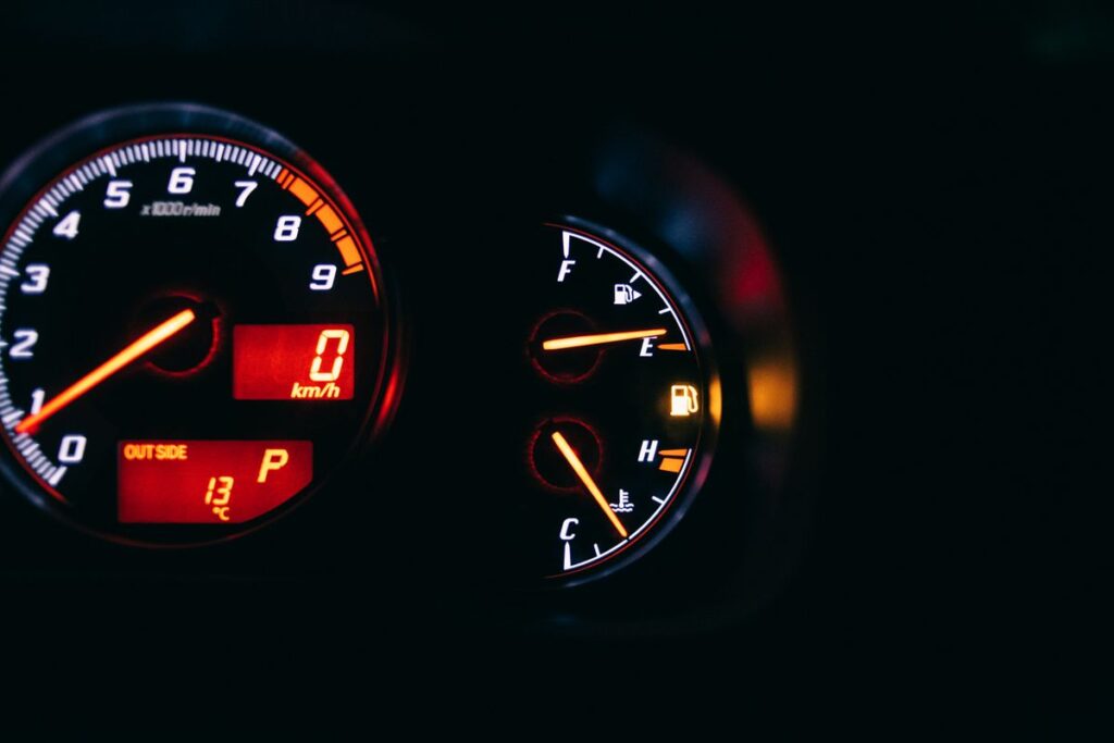 Gauges glowing on a dashboard at night