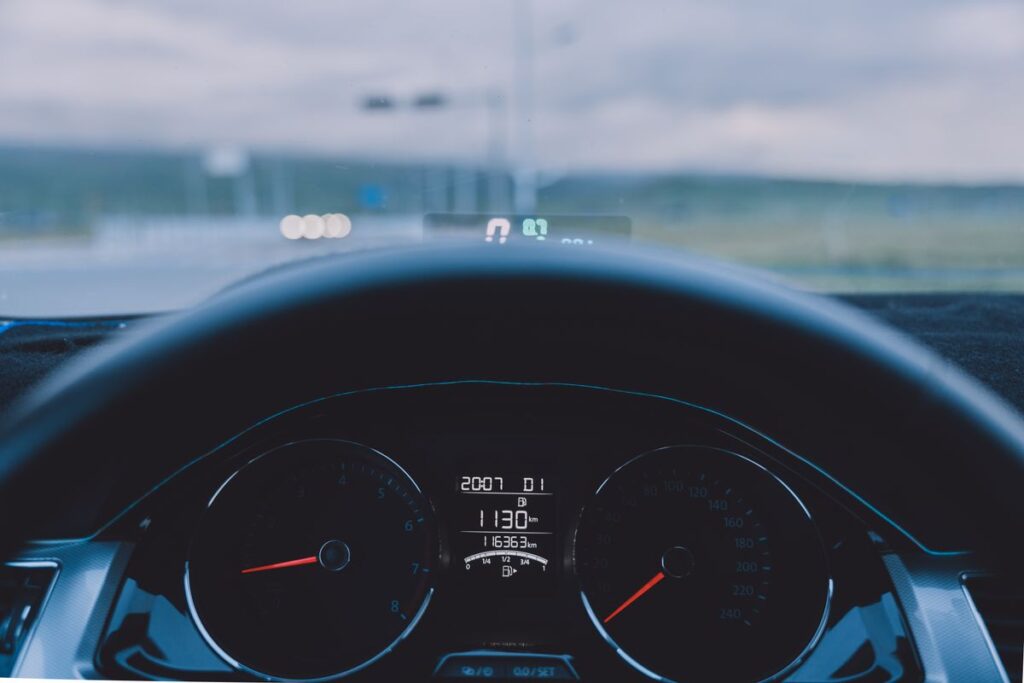 Car dashboard and steering wheel seen from the driver's seat
