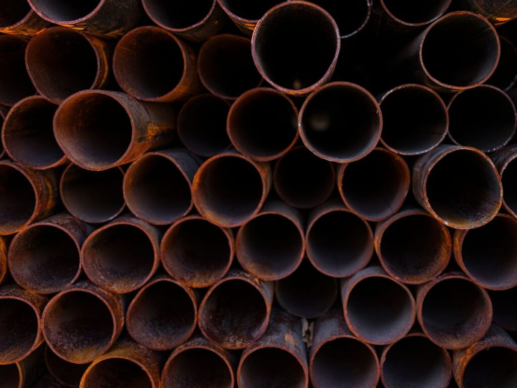Stacked rusted steel tubing