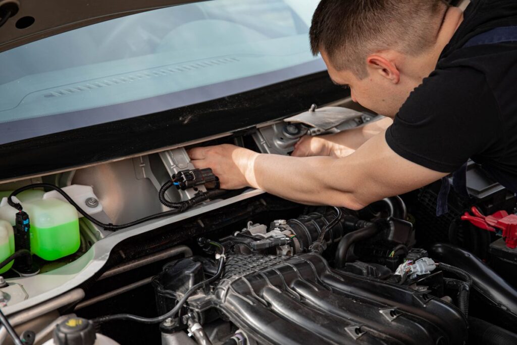 Mechanic working in an engine bay
