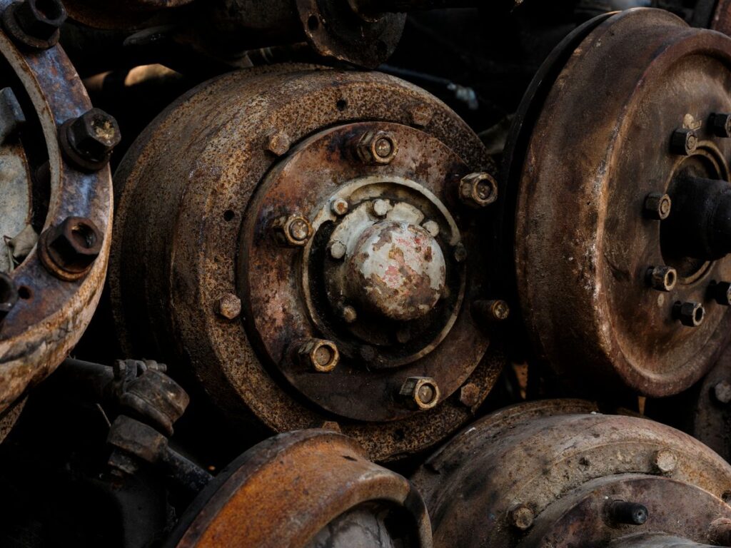 Heavily rusted brake drums showing corrosion